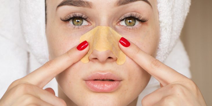 Woman putting on pore strip