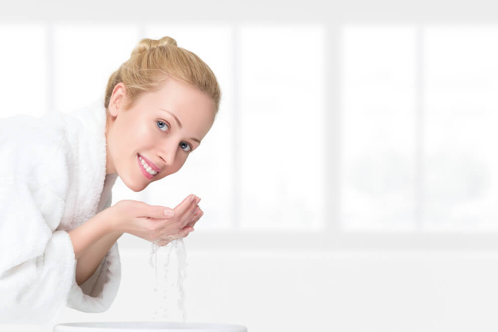 Woman washing face