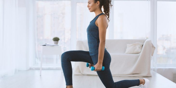 Woman working out at home - stay active