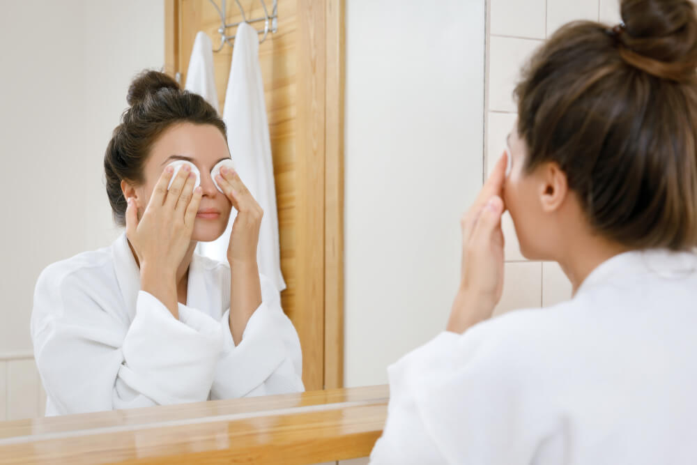 Woman removing makeup