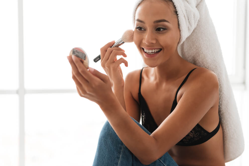 Woman applying makeup