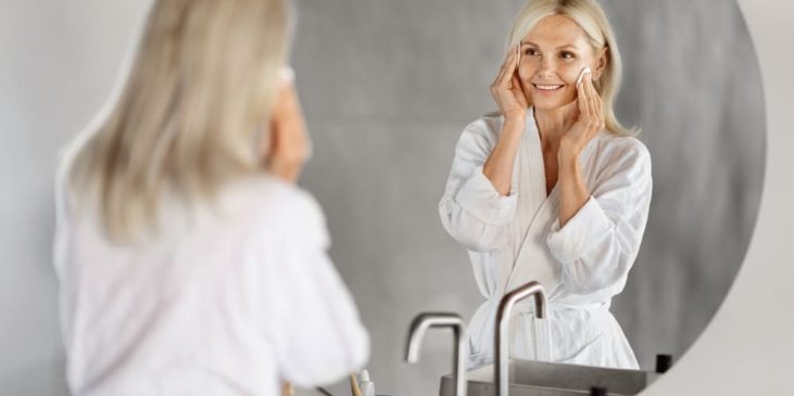 Woman with mature skin carrying out skincare routine for skin barrier support