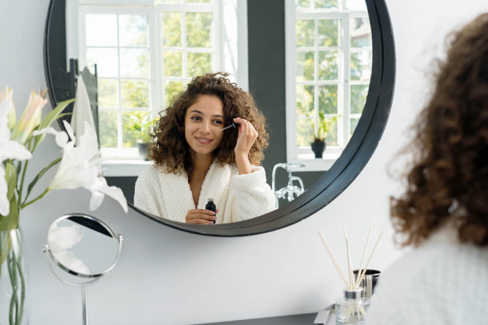 Woman applying serum