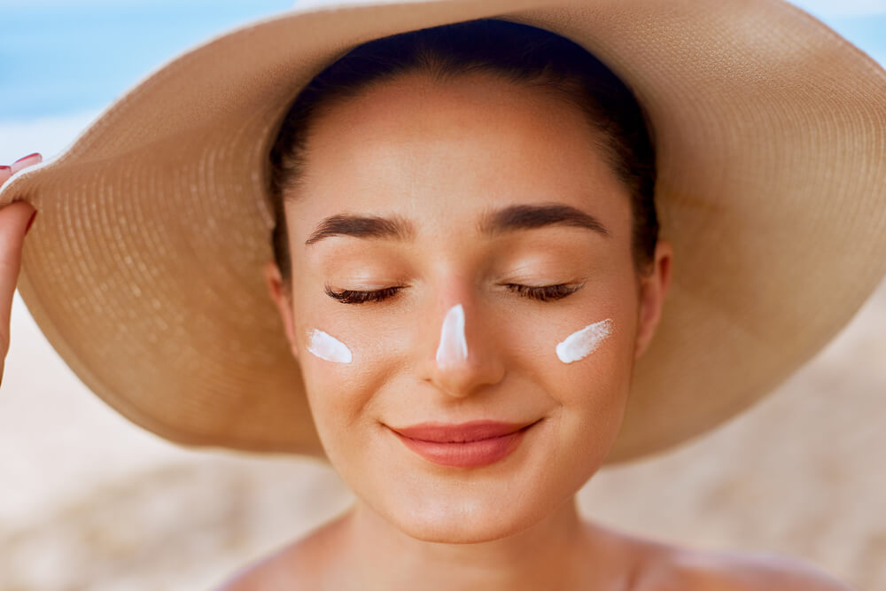 Woman with sunscreen on face