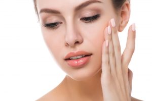 woman touching face