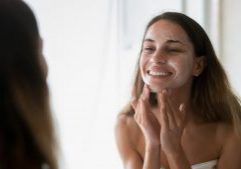 woman cleansing face