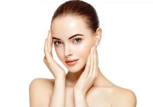 woman holding face