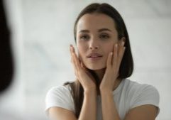 Woman holding face