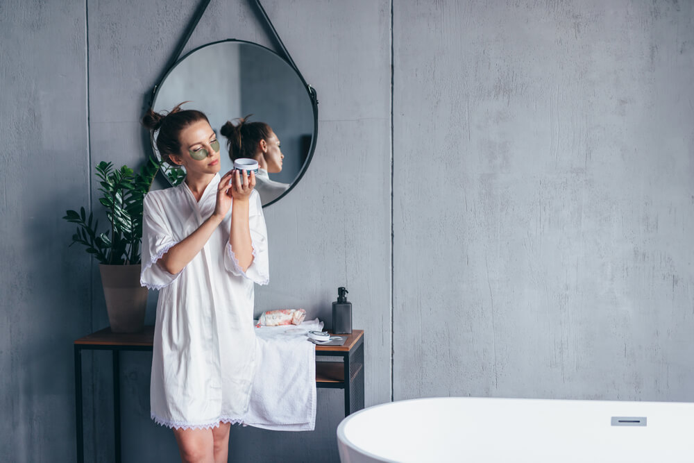 woman reading skincare label