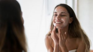 woman cleansing face