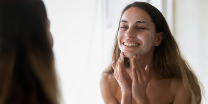 woman cleansing face