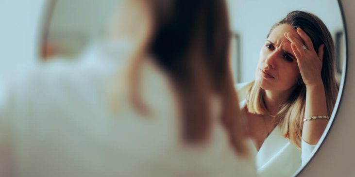 woman mirror skincare